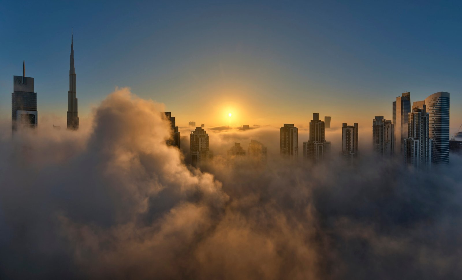 View of the Burj Khalifa and other skyscrapers above the clouds in Dubai, United Arab Emirates.